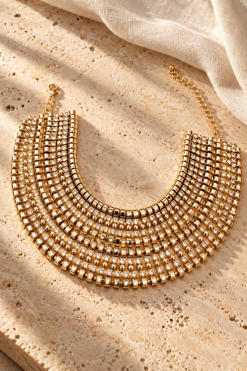 Golden Goddess Rhinestone Collar Necklace on stone