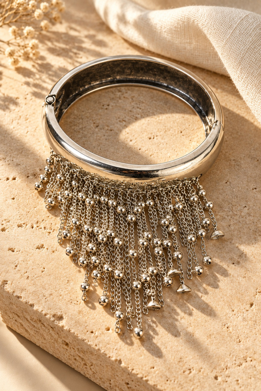 Shimmy Silver Fringe Bangle on stone