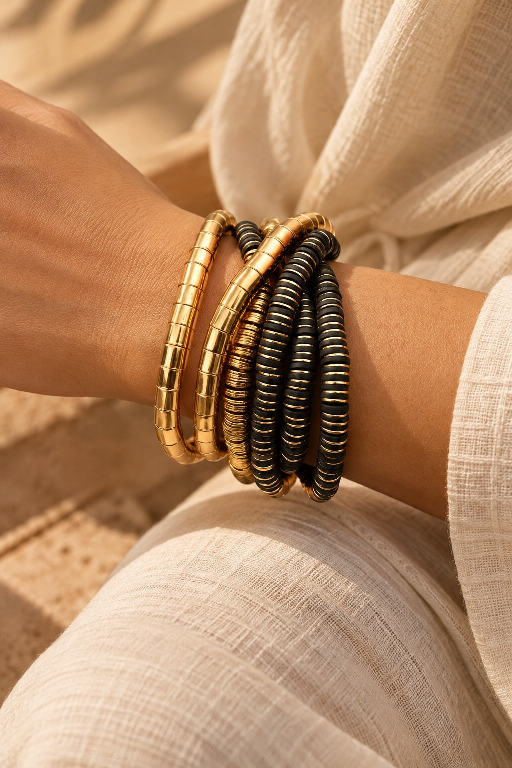 Golden Noir Coil Bracelet Stack worn, close-up