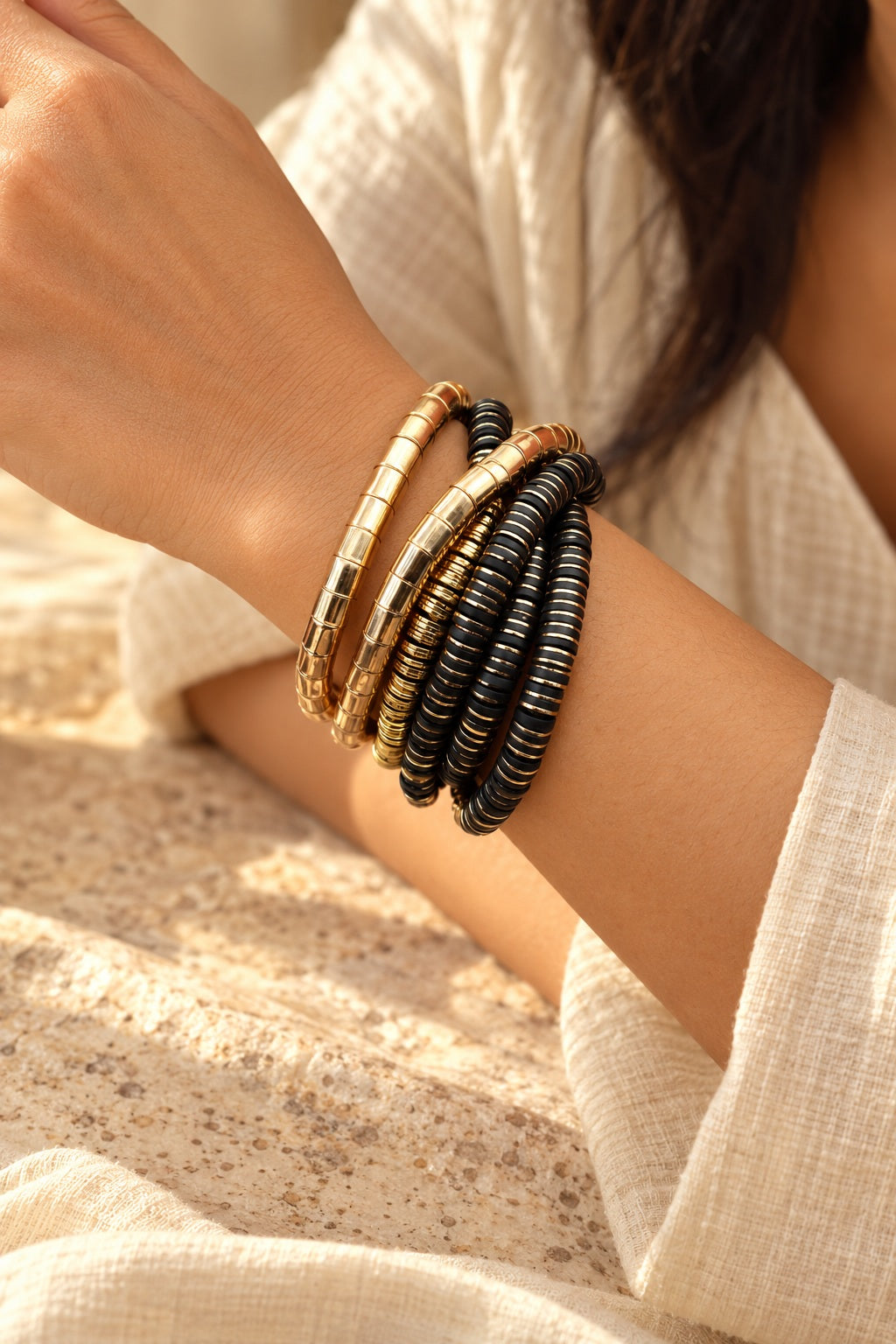 Golden Noir Coil Bracelet Stack worn