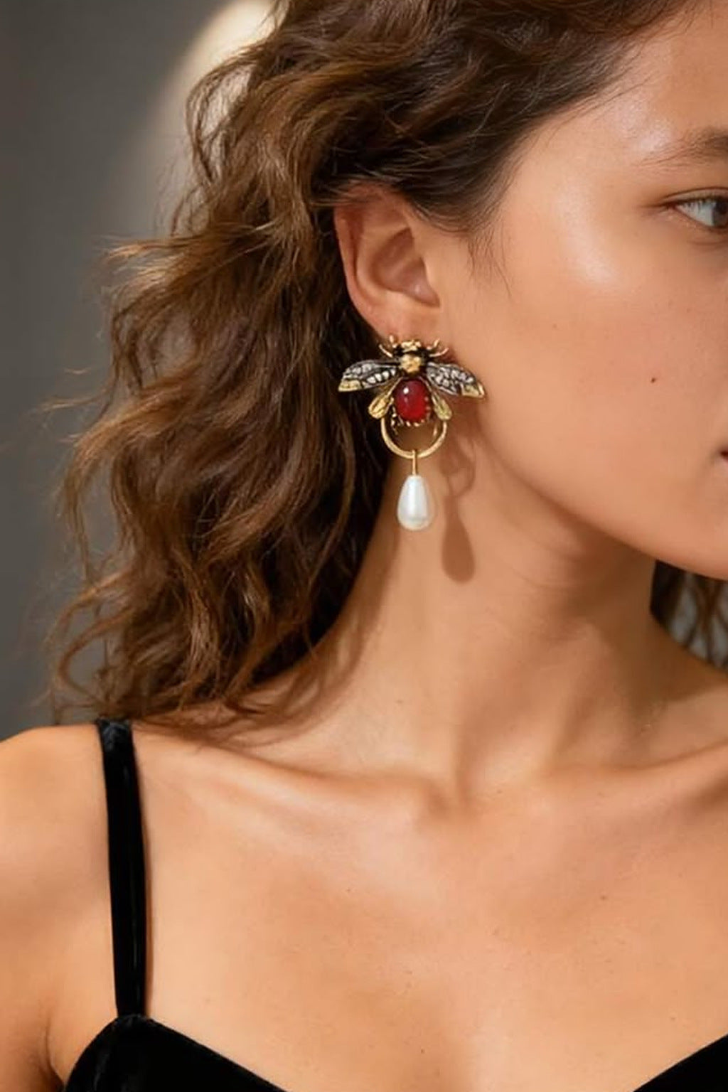 Ruby Bee Pearl Drop Earrings worn with a black top
