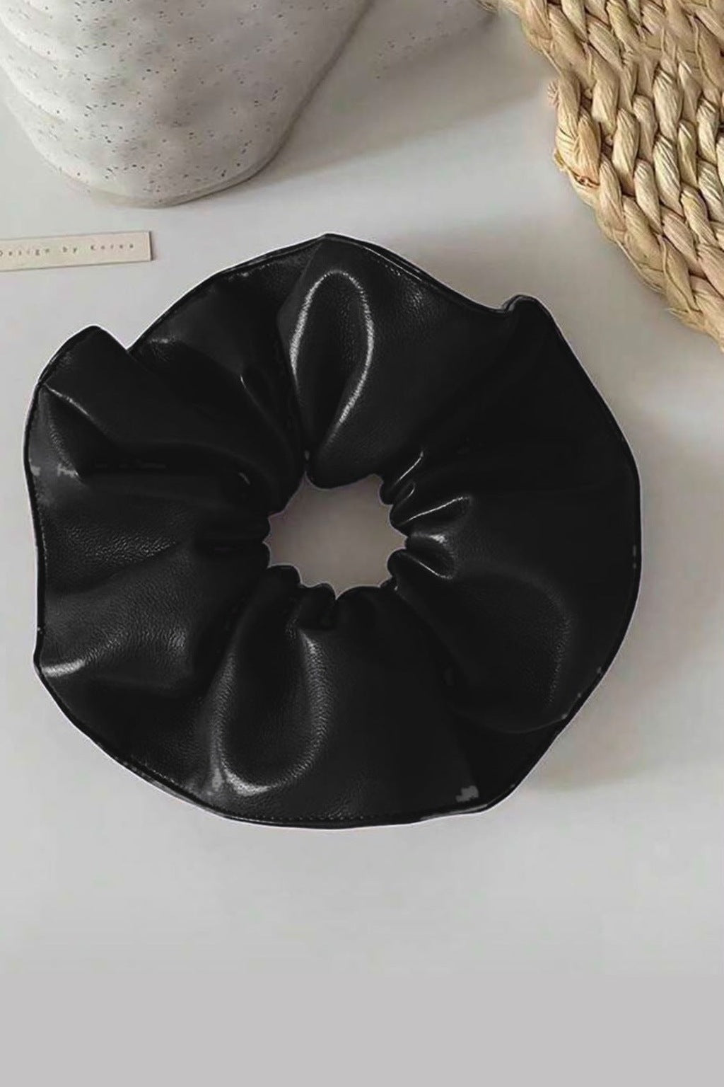 Big Leather Scrunchie - Black – black faux leather flat lay
