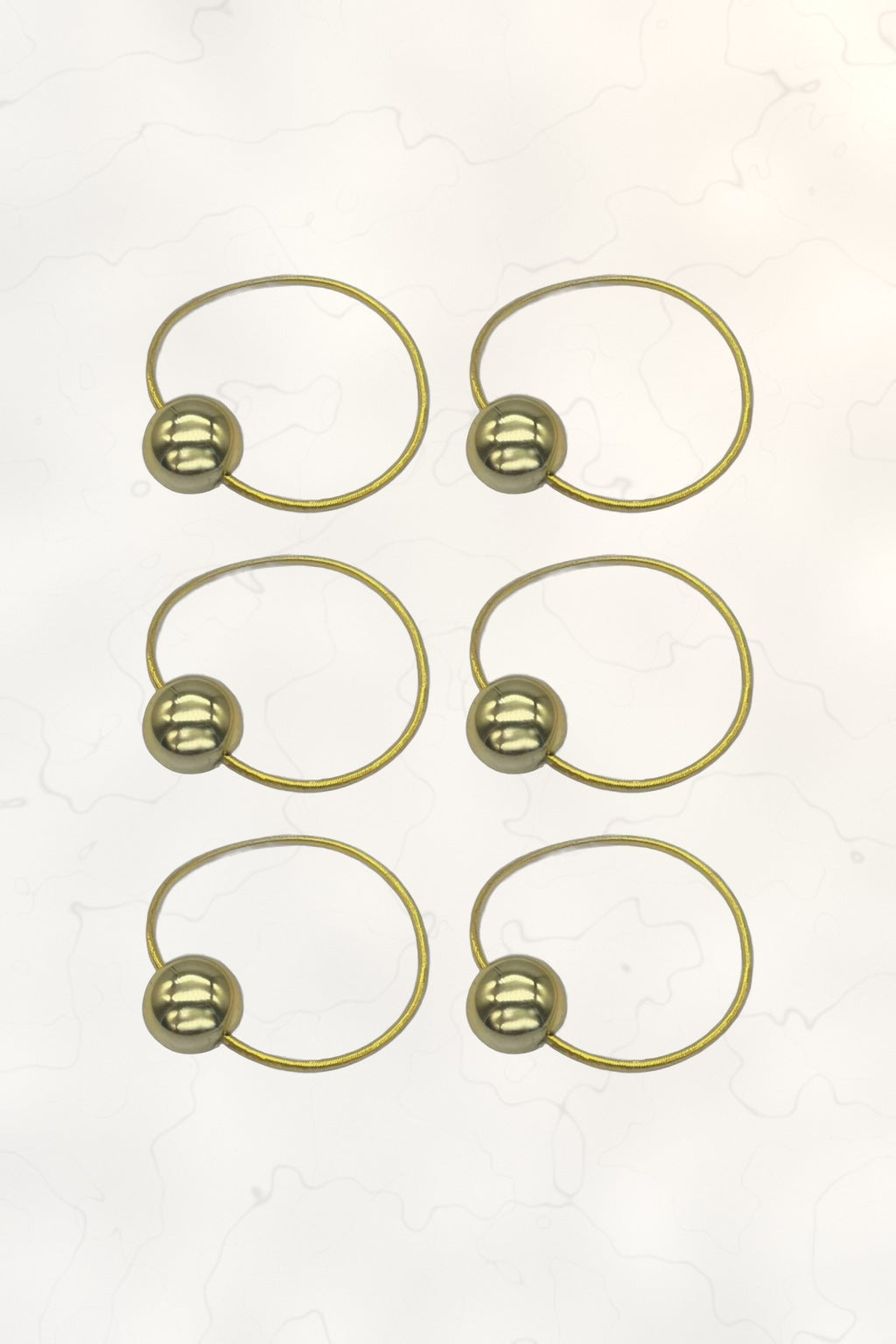Bubble Ponytail Set of 6 – 6 gold ball hair ties on white marble