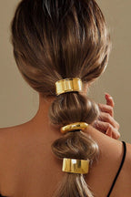 Gold ponytail cuffs worn on a bubble ponytail