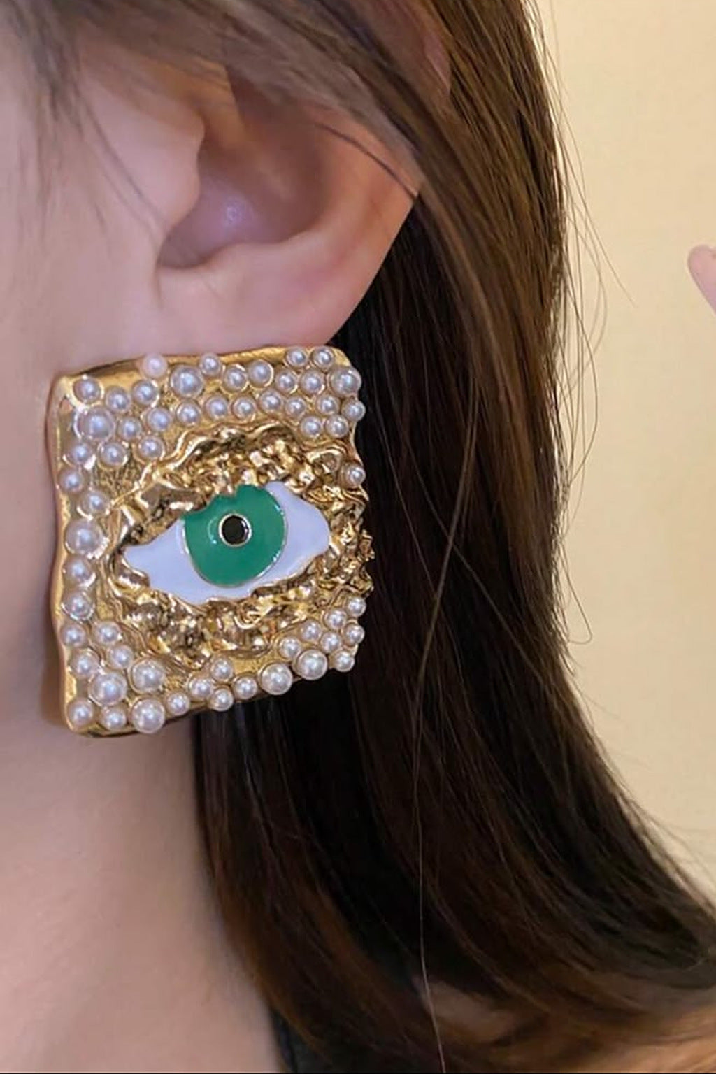 Emerald Gaze Square Stud Earrings, gold evil eye pearl studs, on model