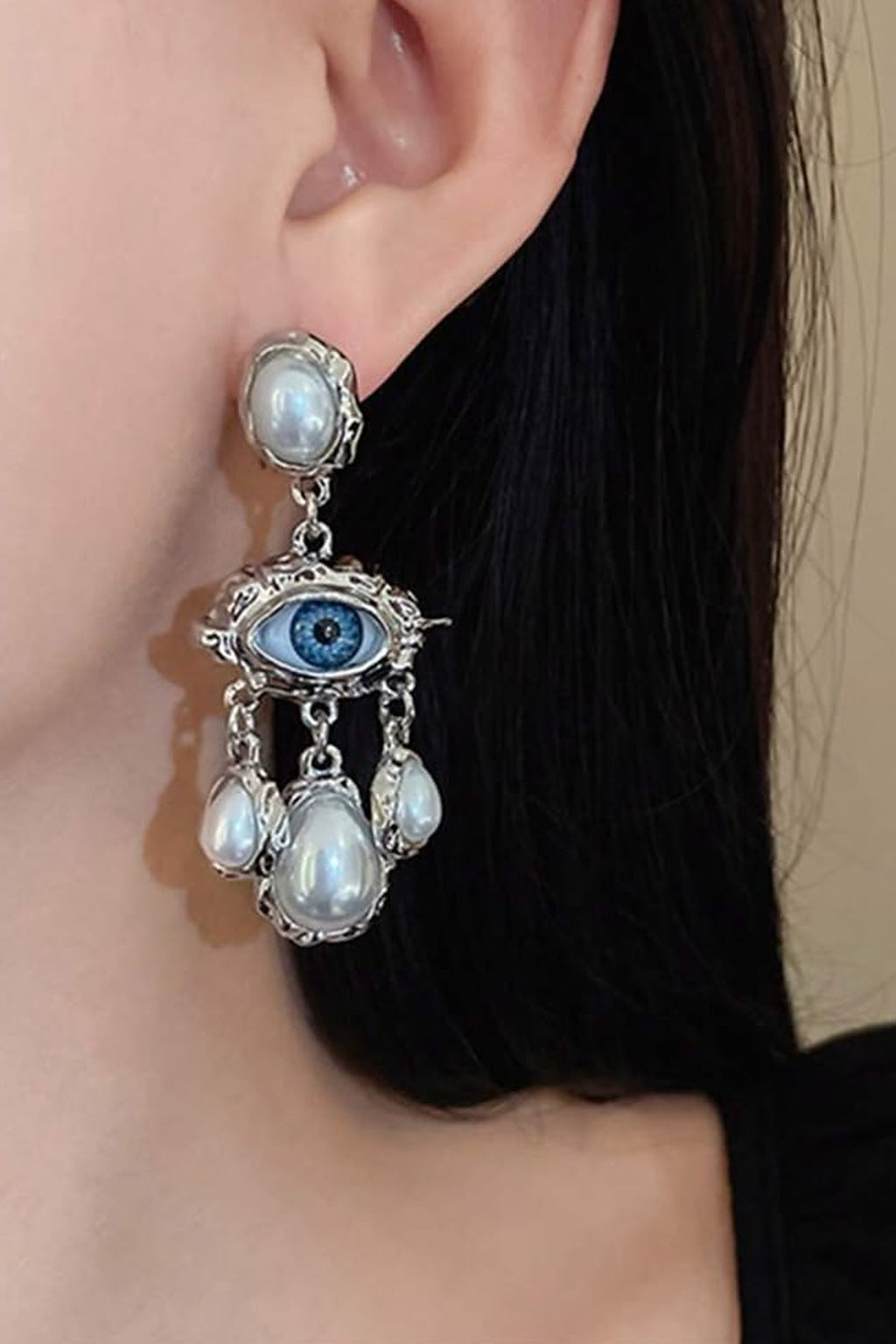Lucky Lash Pearl Drop Earrings worn by a model