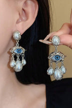 Lucky Lash Pearl Drop Earrings worn, with the pair