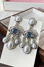 Lucky Lash Pearl Drop Earrings pair on card