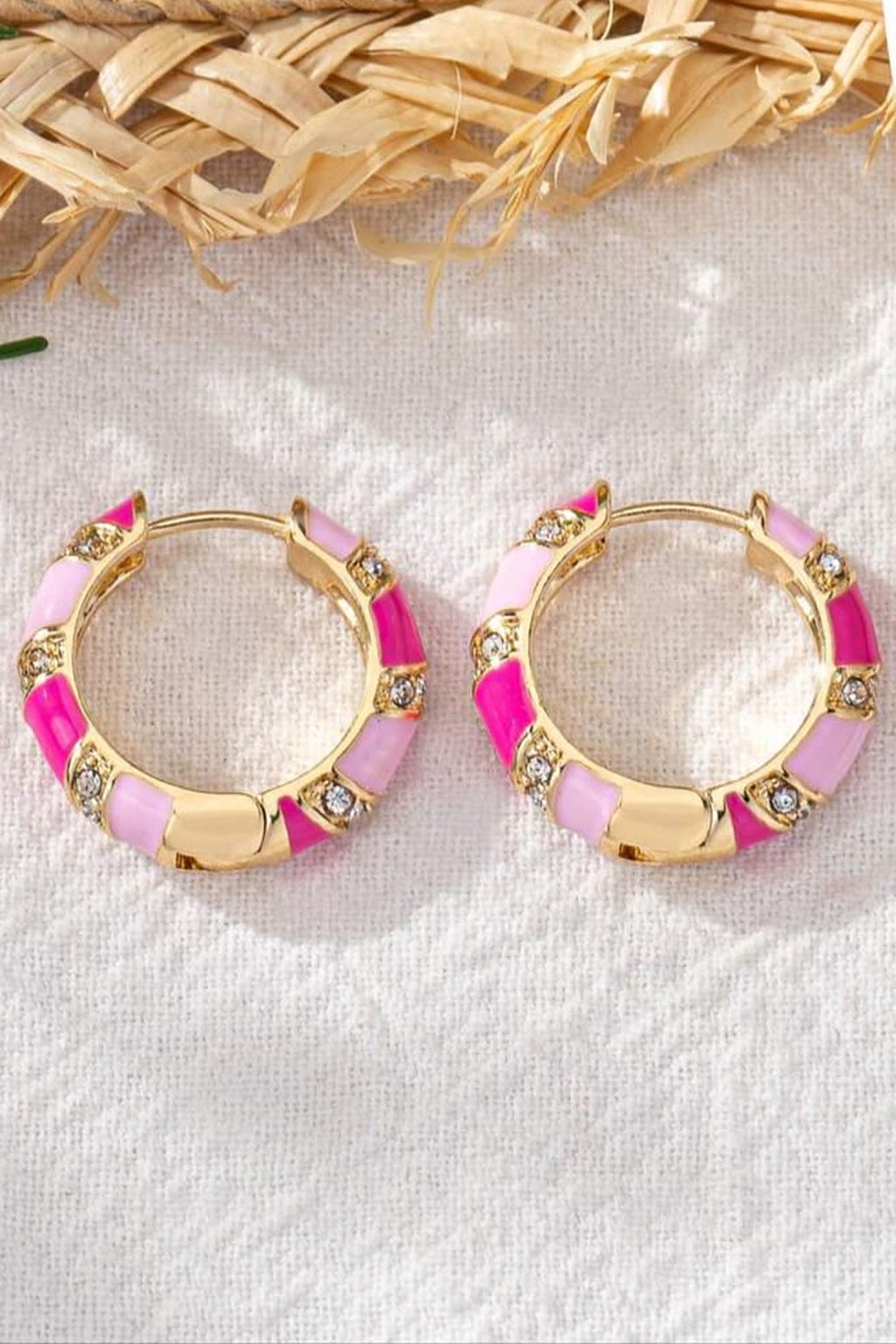 Pink Candy Stripe Hoop Earrings pair flat lay on linen