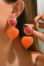 Heart Throb Drop Earrings, orange heart drop earrings with pink stud, on model