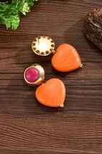 Heart Throb Drop Earrings flat lay on wood