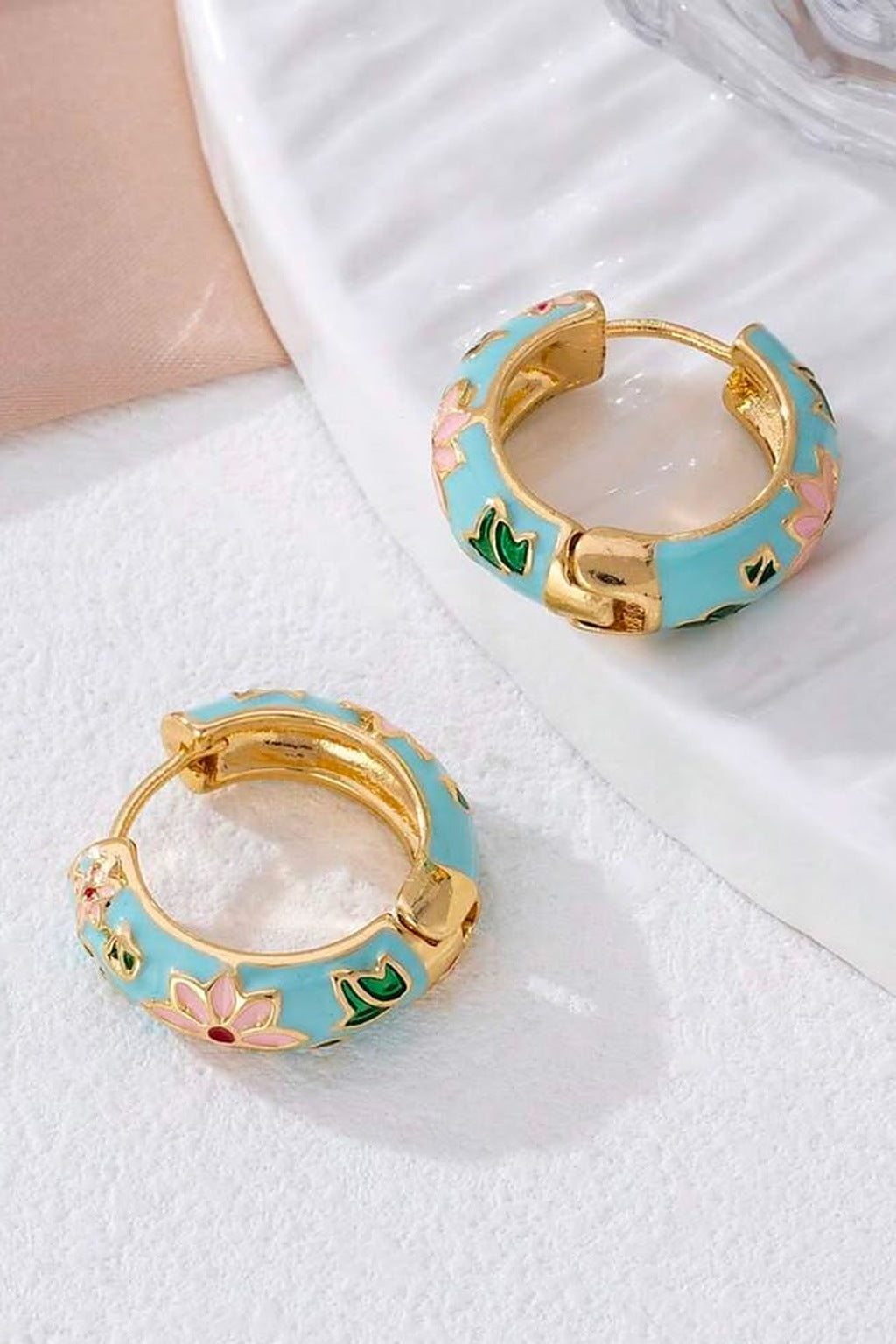 Lotus Lagoon Huggie Earrings pair on marble
