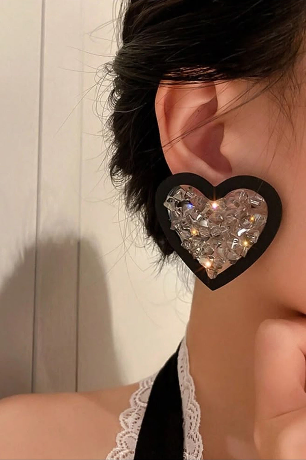 Crystal Crush Heart Earrings, black heart stud earrings with crystal chips, on model