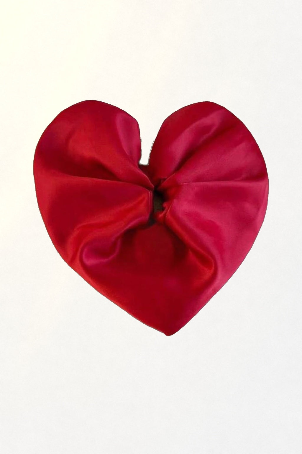 Big Heart Scrunchie – red satin heart scrunchie on white in soft sunlight