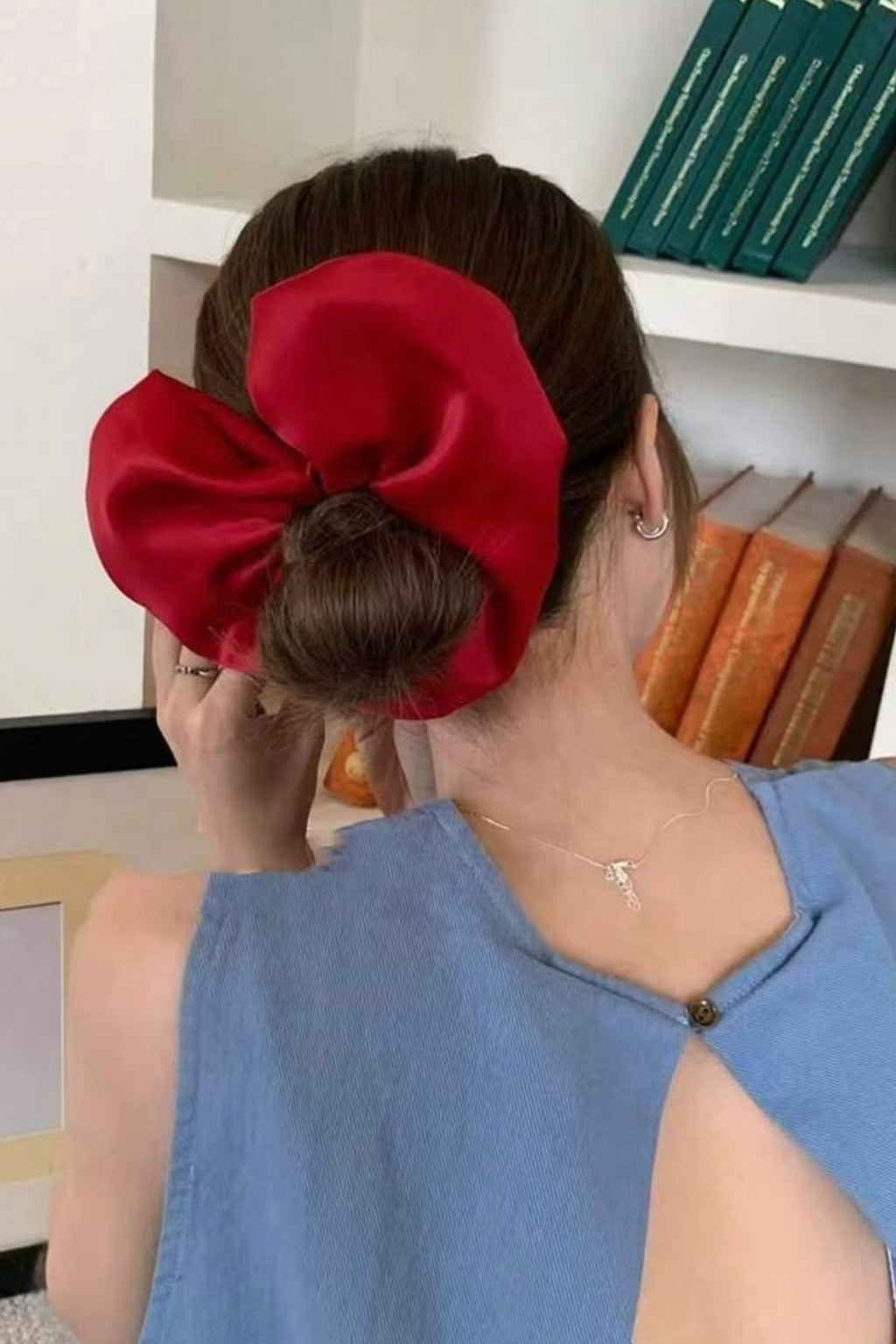 Big Heart Scrunchie worn on a bun, side view