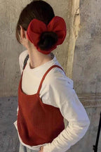 Big Heart Scrunchie worn on a bun with a red top