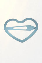 Korean Heart Snap Clip – pastel blue heart hair clip on white in soft sunlight