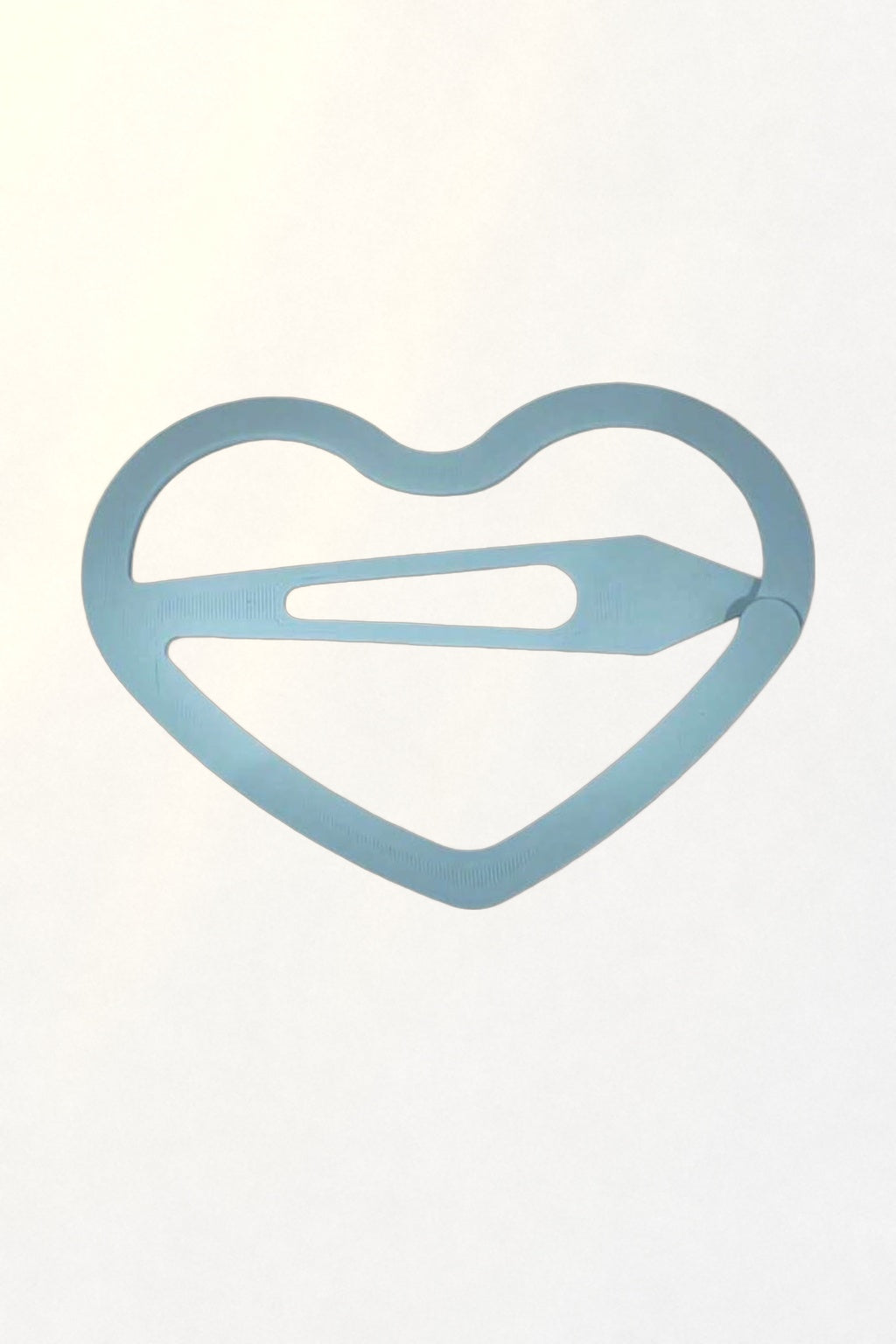 Korean Heart Snap Clip – pastel blue heart hair clip on white in soft sunlight
