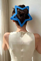 Starry Snap Clip worn on a bun, back view