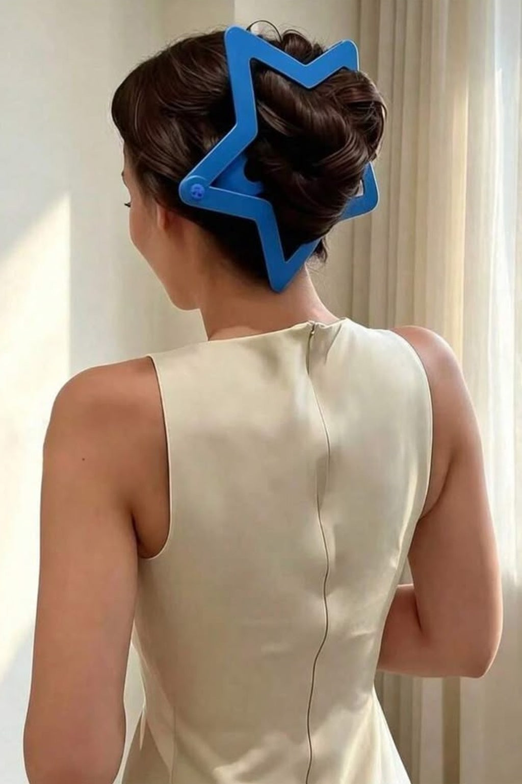 Starry Snap Clip worn on a bun, side view