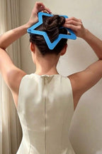Starry Snap Clip being snapped into a bun
