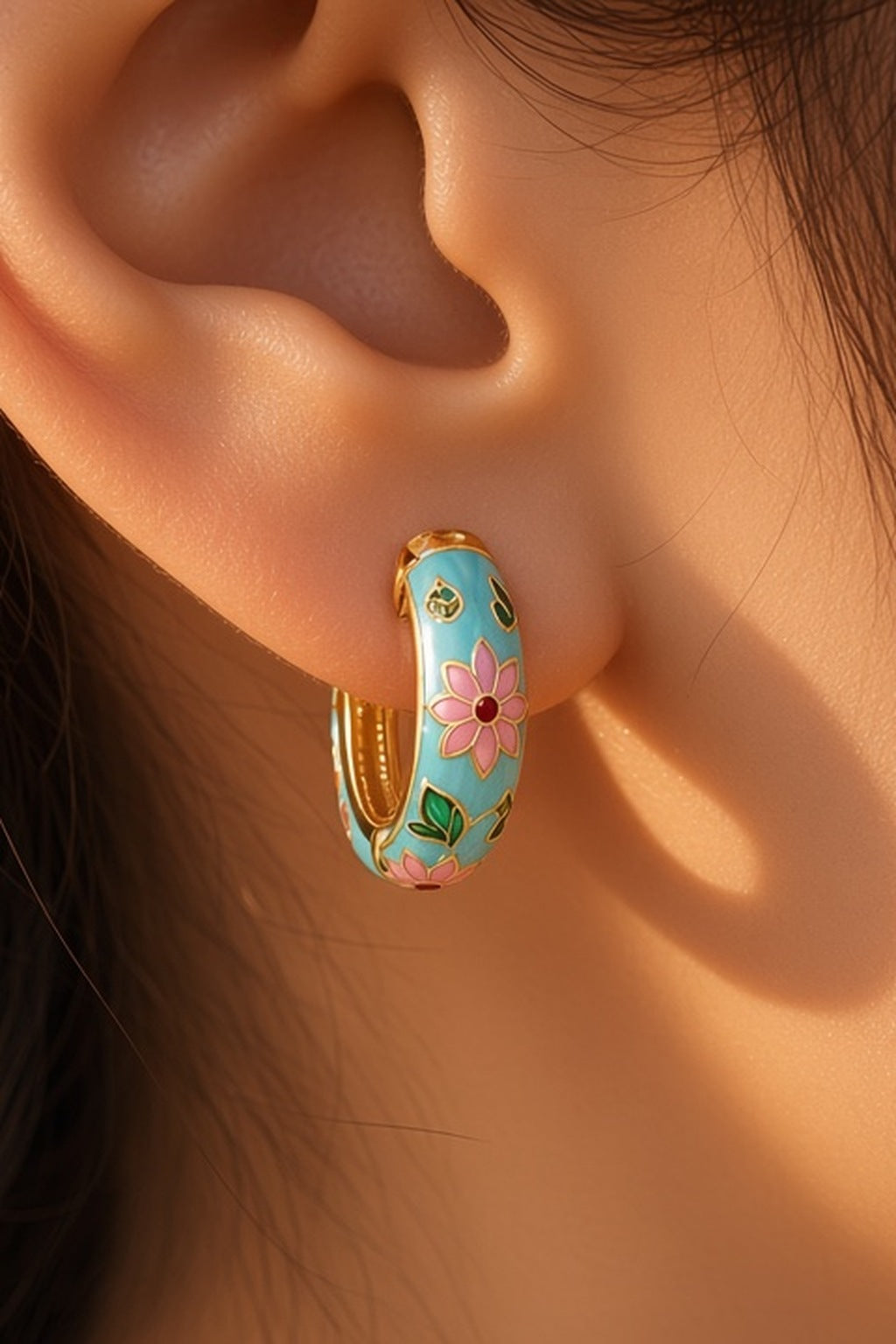 Lotus Lagoon Huggie Earrings – turquoise enamel lotus huggies worn, ear close-up