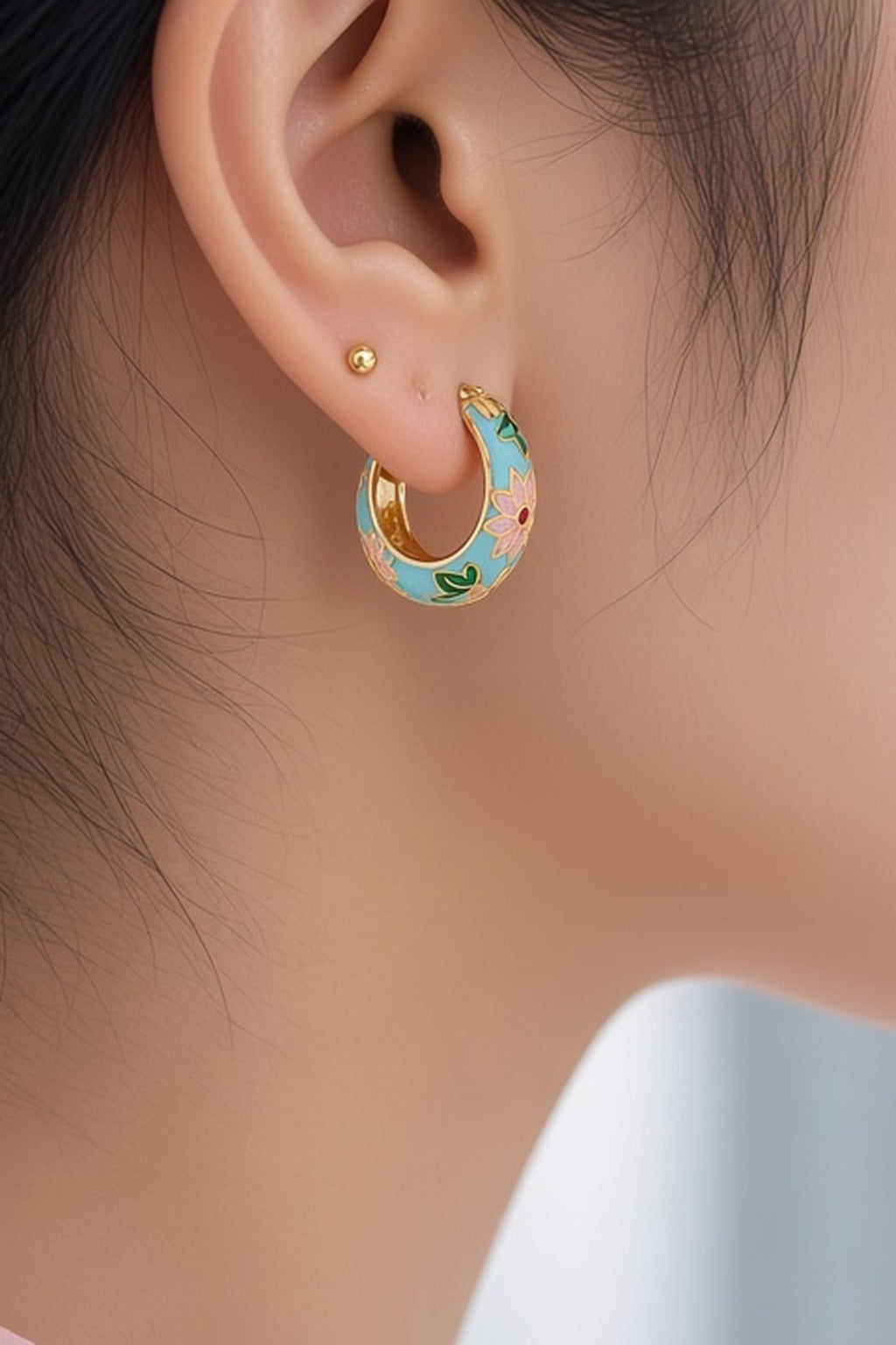 Lotus Lagoon Huggie Earrings – turquoise enamel lotus huggies worn with a low bun