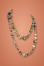 Mermaid Wrap Necklace – long shell chip necklace on a warm terracotta background