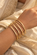 Golden Halo Wire Bangle Stack worn