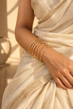 Golden Halo Wire Bangle Stack worn with a saree