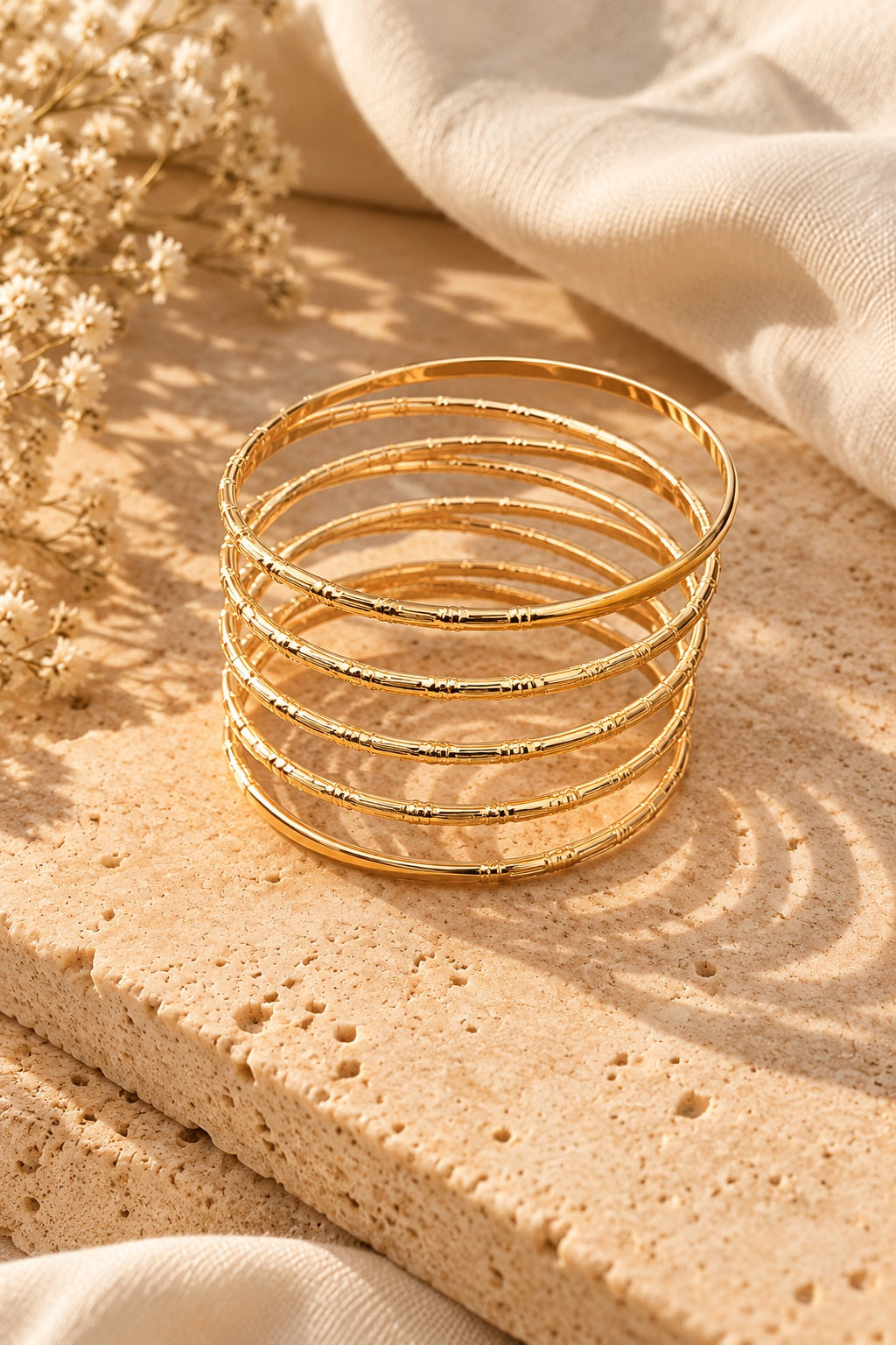 Golden Halo Wire Bangle Stack on stone