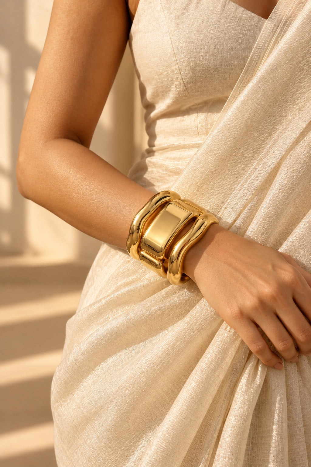 Liquid Gold Sculpt Bangles worn with a saree