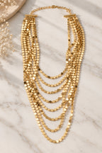 Golden Shimmer Layered Coin Necklace flat lay