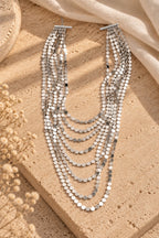 Silver Shimmer Layered Sequin Necklace on stone