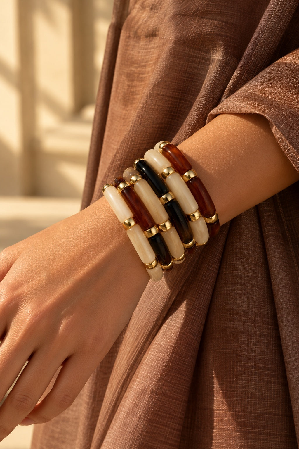 Mocha Noir Tube Bracelet Stack worn, close-up