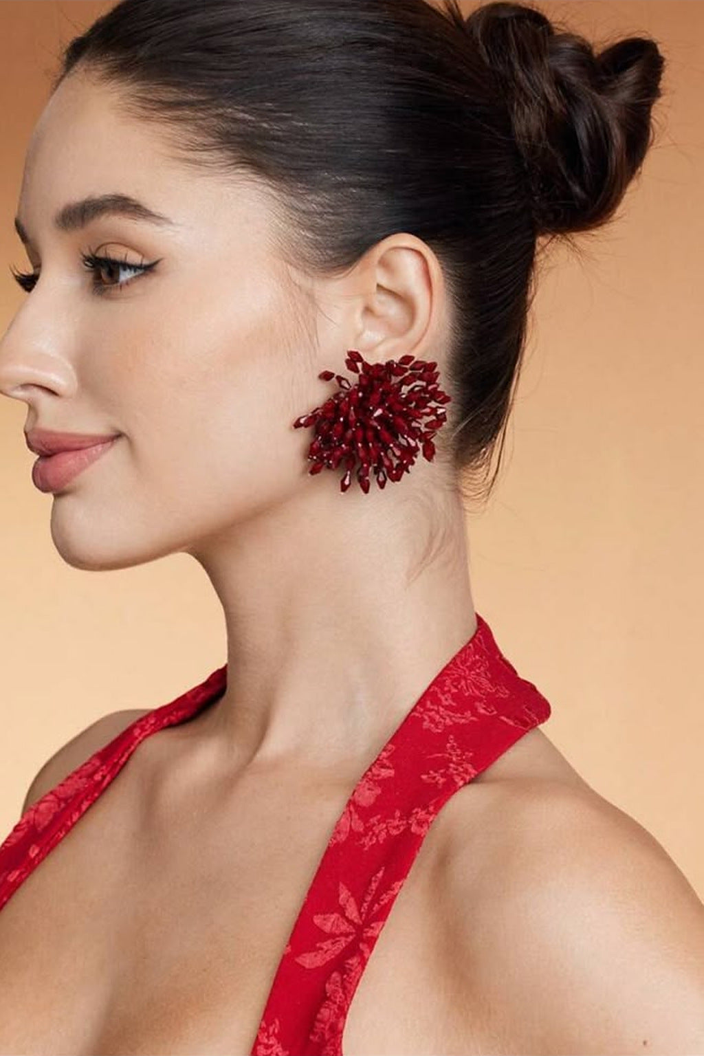 Crystal Firework Stud Earrings in burgundy on model, side view