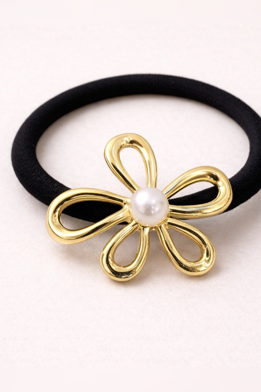 Gold pearl daisy hair tie close-up