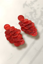 Red Shell Cascade Earrings – red capiz shell disc drop earrings on white marble in warm golden-hour sunlight
