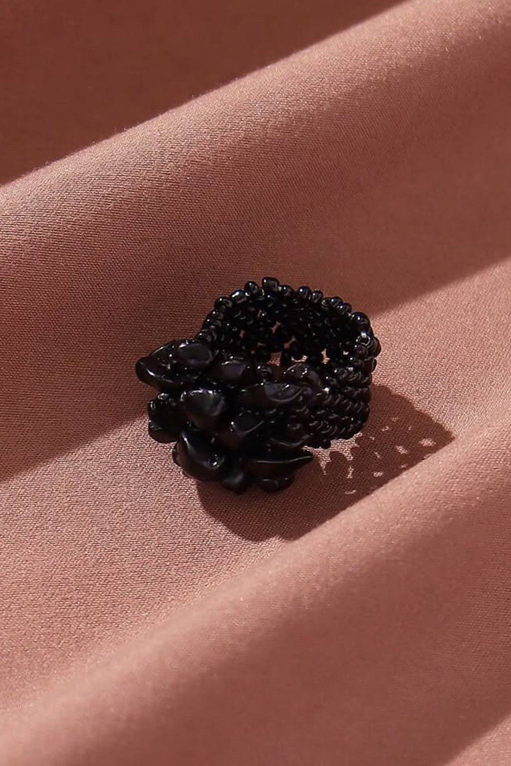 Midnight Bloom Stretchable Cluster Ring on fabric, top view