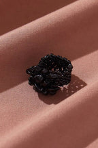 Midnight Bloom Stretchable Cluster Ring on fabric, top view