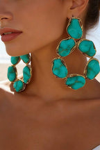Turquoise Treasure Teardrop Hoop Earrings worn by a model